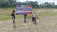 Polres Kuansing Gencarkan Pemasangan Spanduk Stop PETI di Sepanjang Sungai Kuantan